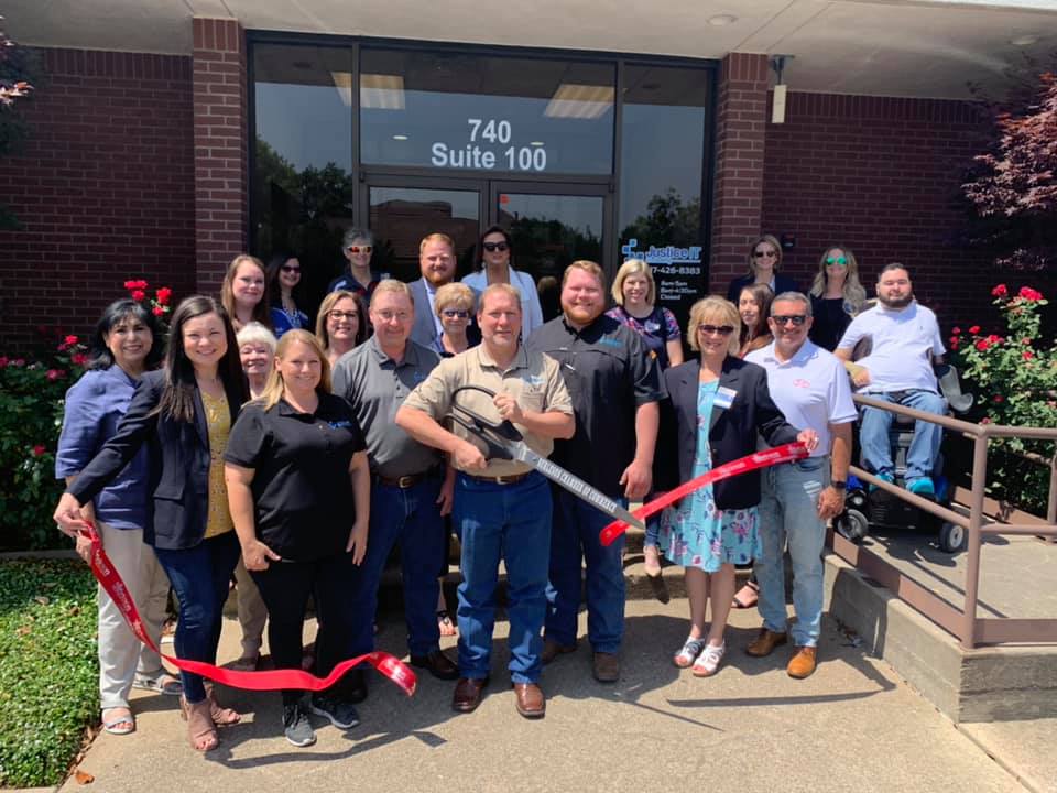 group photo with ribbon cutting